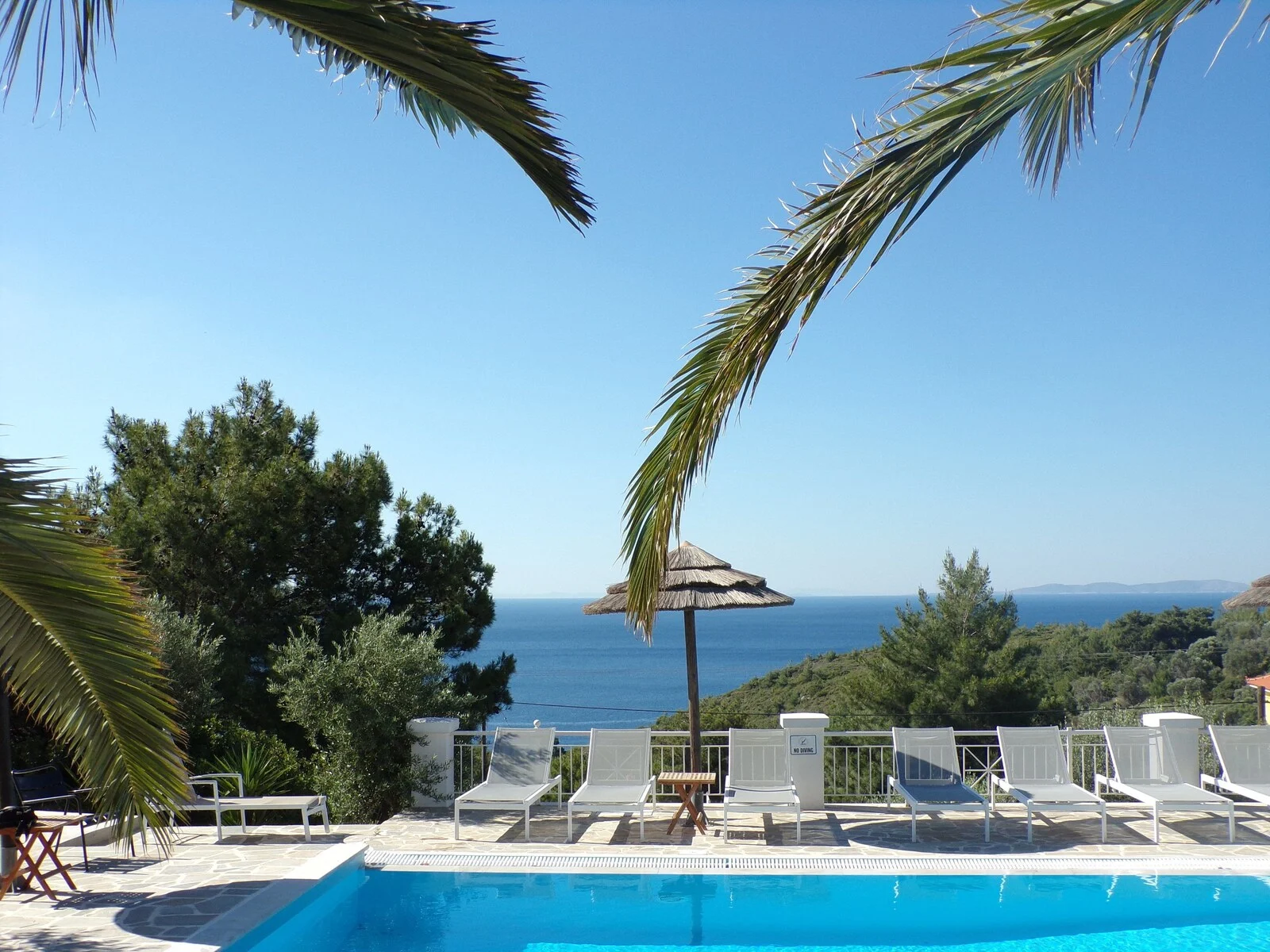 Swimming pool and sun terrace overlooking the sea.