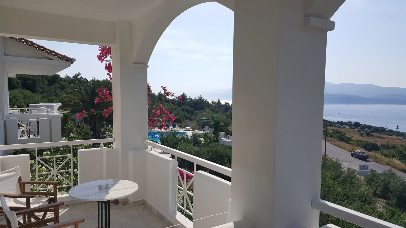 Arched balcony opening overlooking the coast.